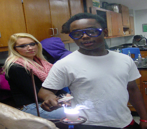 Alexis H. and Bryant S. check the crucible for the formation of MgO