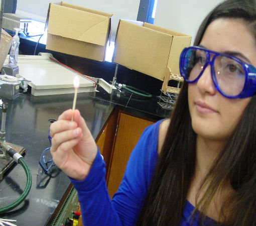 Tori M. prepares to light the bunsen burner